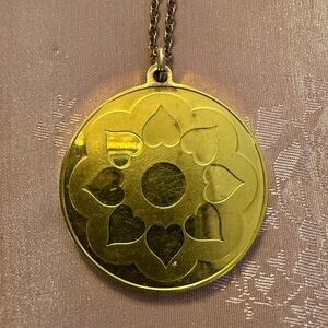 1974 Franklin Mint 24k gold-plated sterling silver hearts and flowers pendant.